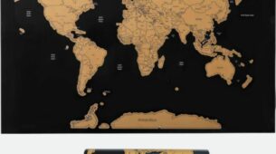 Carte du monde à gratter en noir et or, affichée sur un mur avec des pays révélés en couleurs vives.